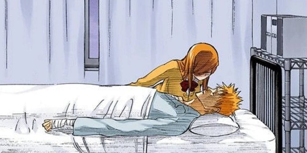 Orihime leans over a sleeping Ichigo in the Bleach manga